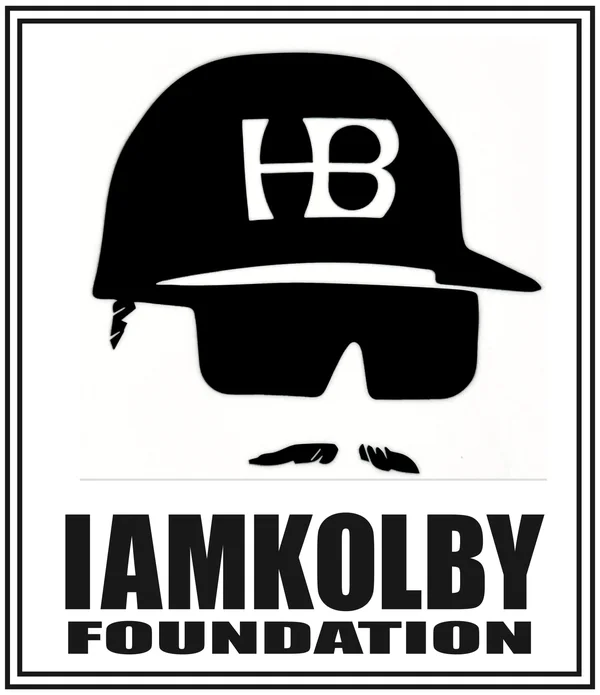 I Am Kolby Foundation helmet and sunglasses mark